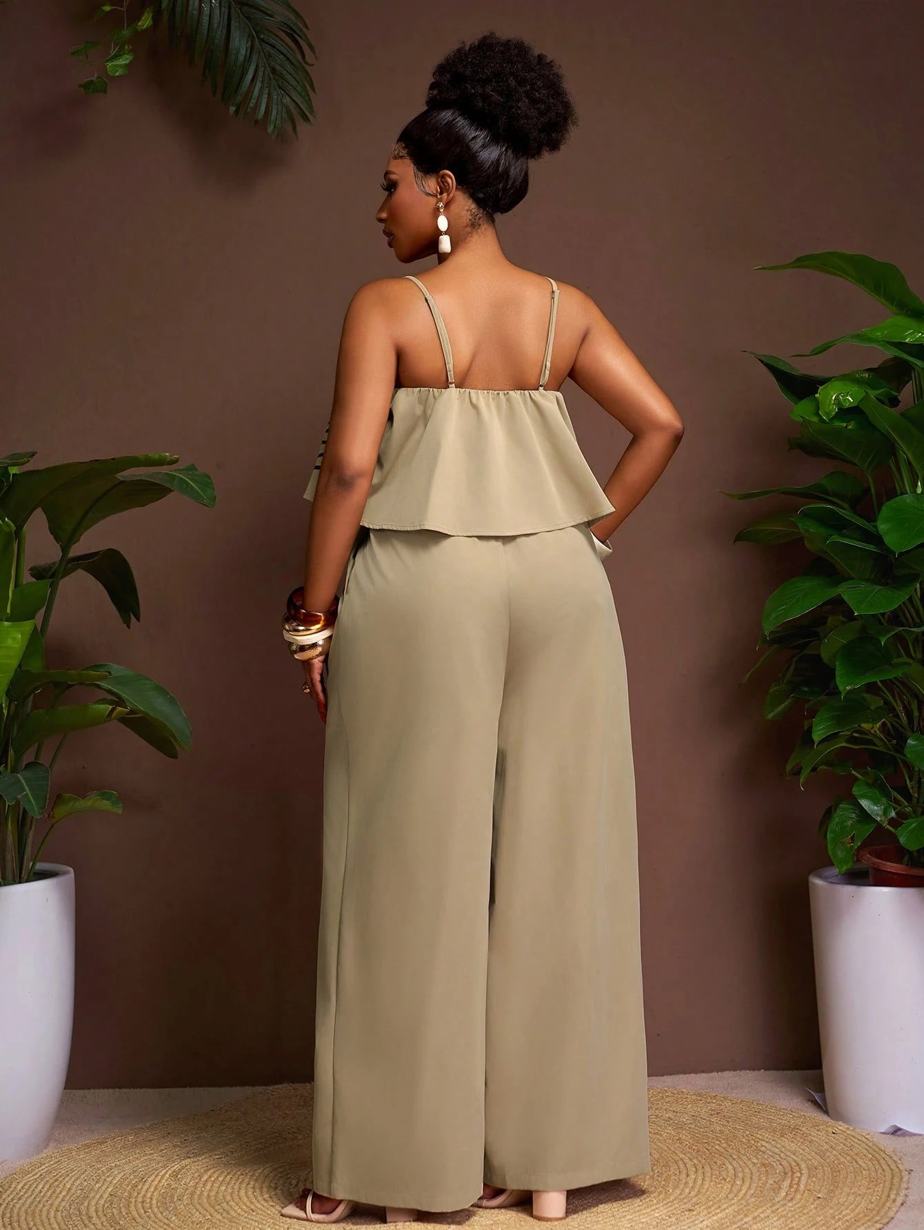 Plus-size sleeveless patterned top and wide leg pants set