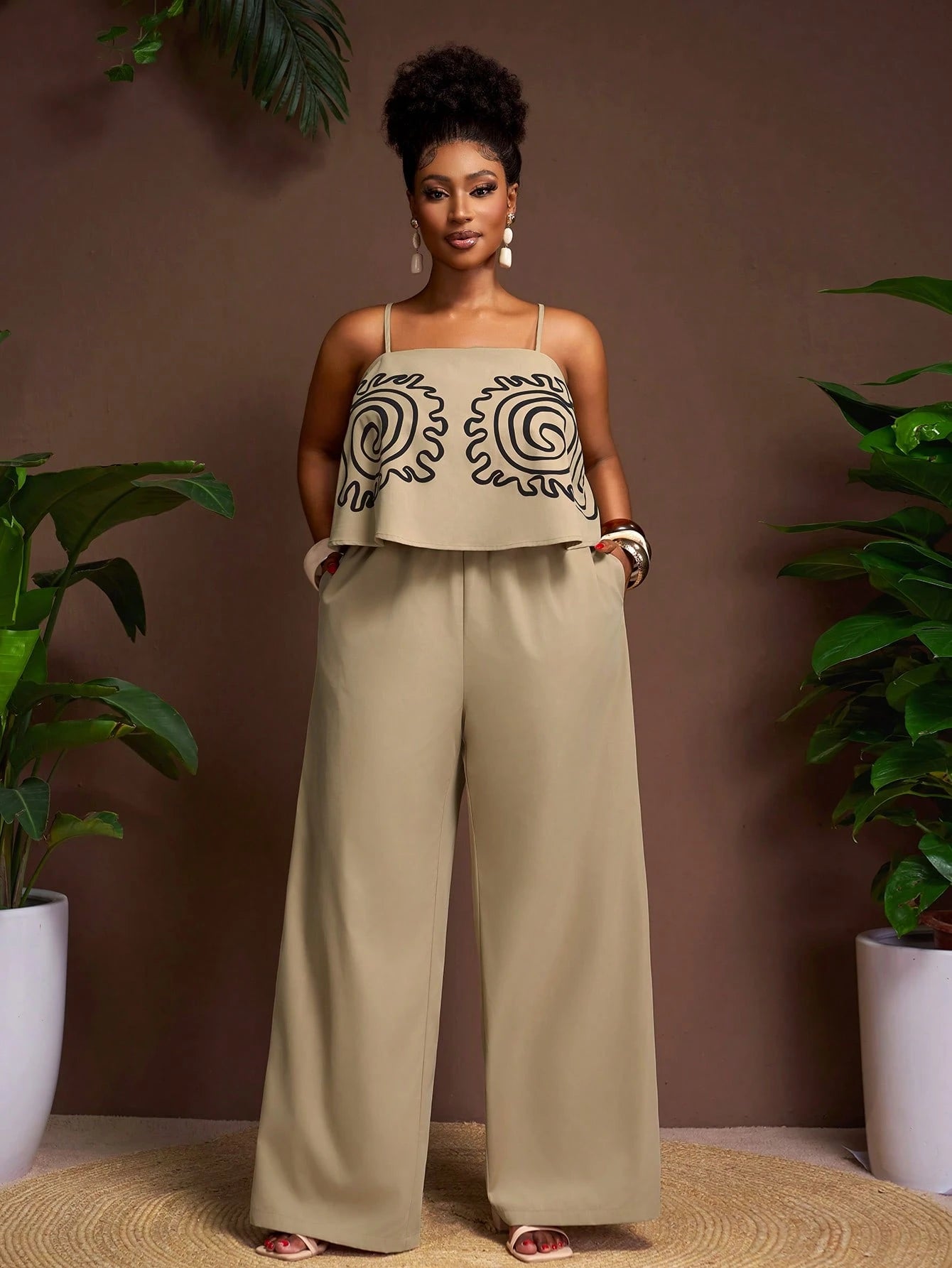Plus-size sleeveless patterned top and wide leg pants set