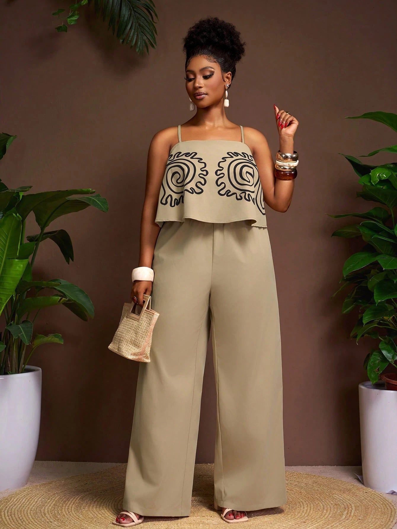 Plus-size sleeveless patterned top and wide leg pants set